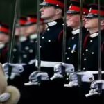queen-elizabeth-made-prince-harry-crack-a-smile-at-a-military-parade-in-2006.jpg