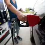 a-customer-readies-to-pump-gas-ap-photo.jpg