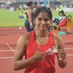g-sindhushree-holding-a-passport-size-photograph-of-her-father-photo-credit-deccan-herald.jpg