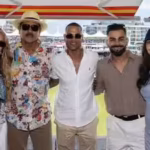 virat-kohli-anushka-sharma-cheer-for-team-india-at-womens-t20-world-cup-clash-pose-with-ravi-shastri.avif