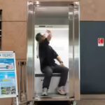 a-person-demonstrates-japan39s-trusco-do-reimon-box-a-walk-in-cooling-booth.jpg