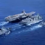 a-type-901-replenishment-ship-center-together-with-the-aircraft-carrier-liaoning-at-top-and-escortin.avif