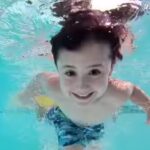 child-swimming-underwater.jpg
