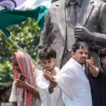 tej-pratap-yadav-stands-atop-the-statue-of-former-mauritius-prime-minister-seewoosagur-ramgoolam-pti.avif