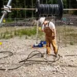 a-worker-prepares-the-well-on-a-boston-area-horse-farm-to-lower-edens-electrode.jpg