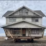 an-iowa-family-moved-the-entire-12000-cherished-farmhouse-four-miles-on-wheels-to-create-their-dream.avif