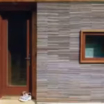 in-2002-alabama-architecture-students-stacked-72000-worn-carpet-tiles-into-the-walls-of-a-family-hom.avif