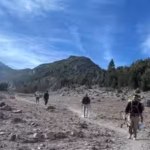 hikers-and-rescuers-make-their-way-down-mount-shasta-after-the-group-became-stranded-during-their-de.avif