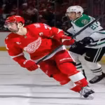 nhl-dylan-larkin-71-of-the-detroit-red-wings-follows-the-play-in-front-of-jason-robertson-21-of-the.avif