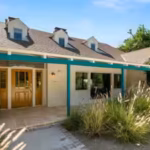 the-property-at-6101-shoup-ave-covers-about-4675-square-feet-and-sits-behind-gates-on-a-nearly-28000.avif