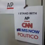 cnn-msnow-and-politico-solidarity-signs-at-the-white-house-in-washington.jpg