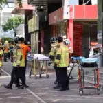 firefighters-and-policemen-gather-outside-the-scene-where-several-people-were-injured-in-a-stabbing.avif