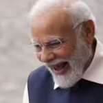 indian-prime-minister-narendra-modi-smiles-prior-to-the-start-of-the-bastille-da.jpg