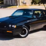 inside-the-gnx-remains-unmistakably-rooted-in-its-era-a-three-spoke-leather-wrapped-steering-wheel-s.avif