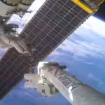 nasa-astronaut-anil-menon-rides-the-canadarm2-robotic-arm-to-install-a-solar-array-on-the-iss-260-mi.avif
